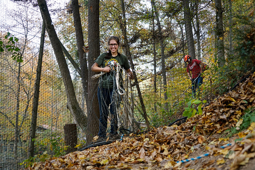 Julia Cecere sorts through a tangle of cables.